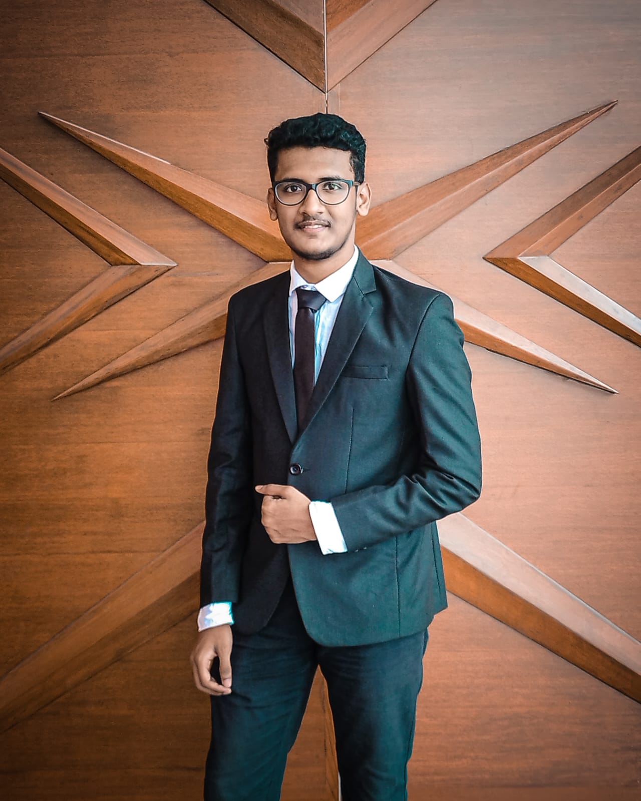 Portrait of Muhsin K M in a dark suit
